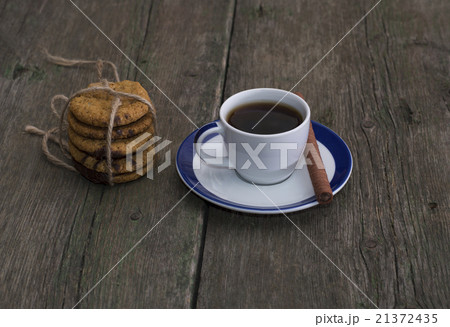cup of coffee and linking of oatmeal cookies 21372435
