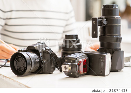 Photo camera lying on the table  21374433
