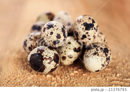 Quail eggs close-up on a wooden board Quail eggs close-up on a wooden board 21376793