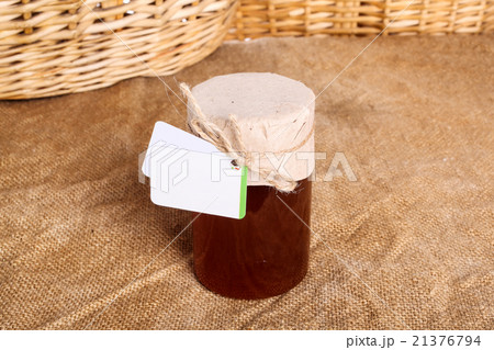 Fresh honey in glass jar, cover paper Fresh honey in glass jar, cover paper 21376794