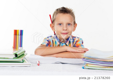 Cute school boy with pencil behind his ear Cute school boy with pencil behind his ear 21378260