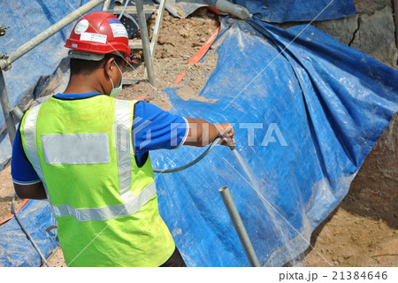 Spraying the anti termite chemical treatment  21384646