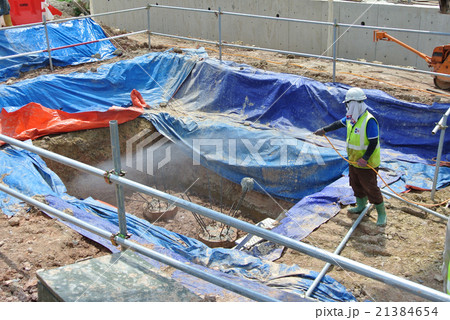 Workers spraying anti termite chemical treatment Workers spraying anti termite chemical treatment 21384654