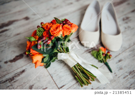 wedding bouquet and shoes, boutonniere on board 21385451