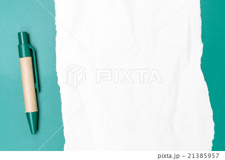 Blank paper crumpled with pen and green background 21385957