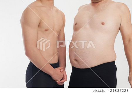 メタボと筋肉 腹 2人の写真素材