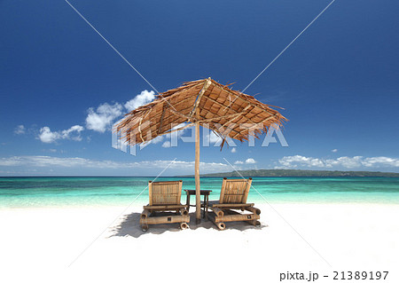 Chairs with parasol on beach Chairs with parasol on beach 21389197