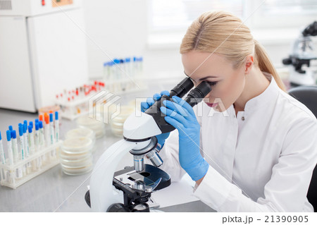 Skillful female researcher is using modern Skillful female researcher is using modern 21390905