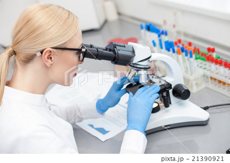Skillful young laboratory assistant is making Skillful young laboratory assistant is making 21390921