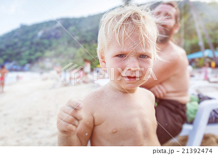 Baby with face in the sand Baby with face in the sand 21392474