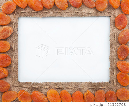 Frame made of burlap with dried apricots Frame made of burlap with dried apricots 21392708