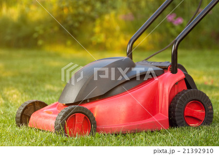 Lawnmower on lawn grass 21392910