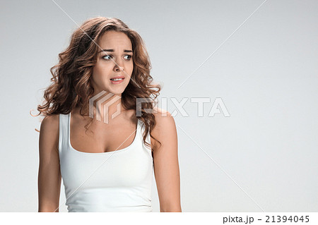 The young woman's portrait with frightened 21394045
