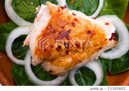 grilled chicken is served in a clay pot 21395602