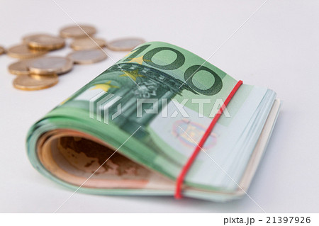 Euro banknotes. and coins. Rolled euro money Euro banknotes. and coins. Rolled euro money 21397926