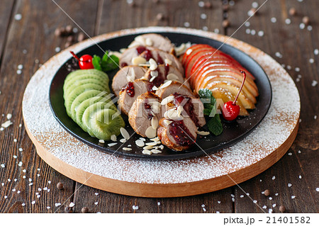 Delicious baked veal with fruits and sauce Delicious baked veal with fruits and sauce 21401582