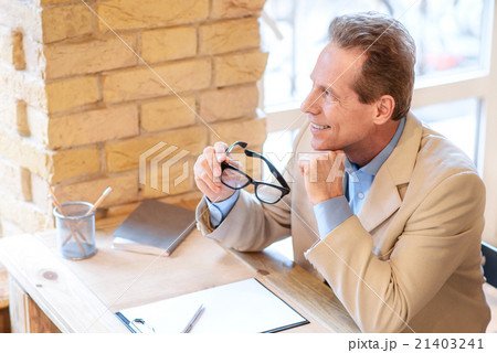 Positive man sitting in the cafe 21403241