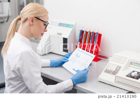 Attractive young scientist is analyzing her Attractive young scientist is analyzing her 21413190