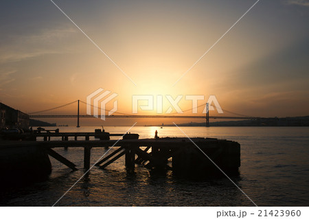 Sunset at Almada Quay and 25 de Abril Bridge Sunset at Almada Quay and 25 de Abril Bridge 21423960