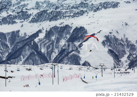 blue skies with clouds over the mountains in snow 21432529