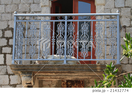 Dog sleeping on the balcony of the old Dog sleeping on the balcony of the old 21432774