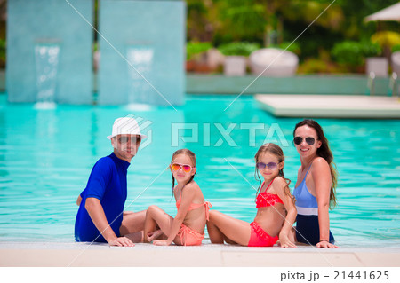 Happy family with two kids in swimming pool 21441625