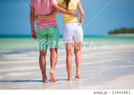 Young couple on white beach at summer vacation Young couple on white beach at summer vacation 21441661