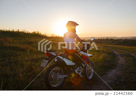 Woman biker in sunset, female motorcycle. Woman biker in sunset, female motorcycle. 21442560