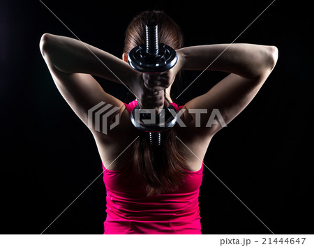 Athlete with kettlebell behind the head 21444647