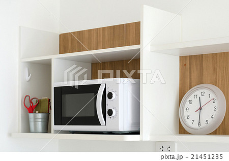 Microwave oven on shelf in pantry 21451235
