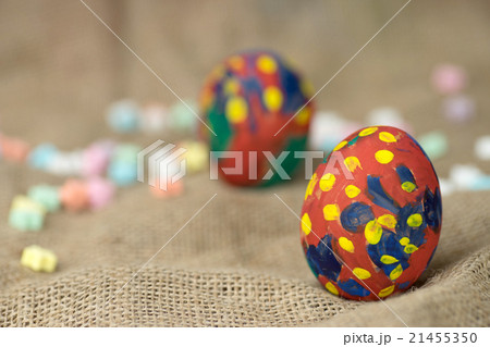 painted egg on burlap cloth and colorful  21455350