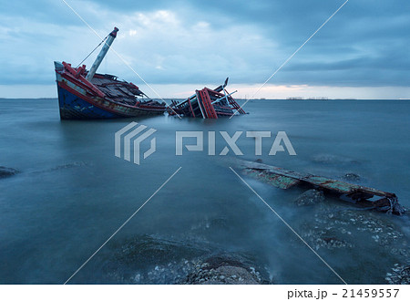 Shipwreck on a Beach with cloudy Sky, Thailand Shipwreck on a Beach with cloudy Sky, Thailand 21459557