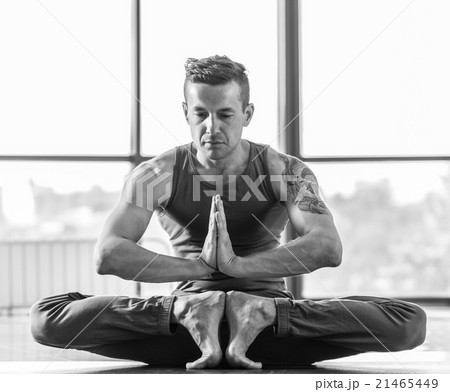 Athletic muscular young man working out, yoga Athletic muscular young man working out, yoga 21465449