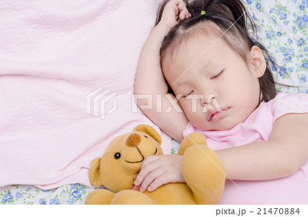 Little Asian girl sleeping on bed Little Asian girl sleeping on bed 21470884