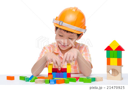 Young Asian boy with helmet playing block on table 21470925