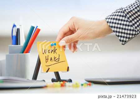 Work hard text on adhesive note 21473923