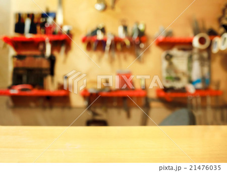 Tools on wall in workshop, blurred background. 21476035