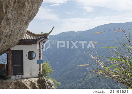Chinese temple in the cliff and mountain scenery (Wenzhou yandang mountain in China.) Chinese temple in the cliff and mountain scenery (Wenzhou yandang mountain in China.) 21491621