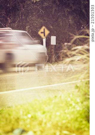 Traffic sign, motion blurred pick-up truck. 21501503