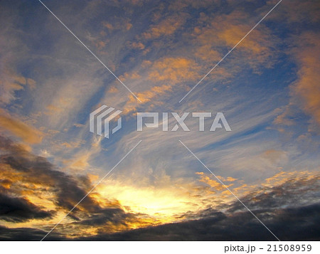 Glowing clouds on moody sky 21508959