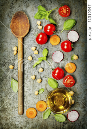 Wooden spoon and fresh ingredients Wooden spoon and fresh ingredients 21510547