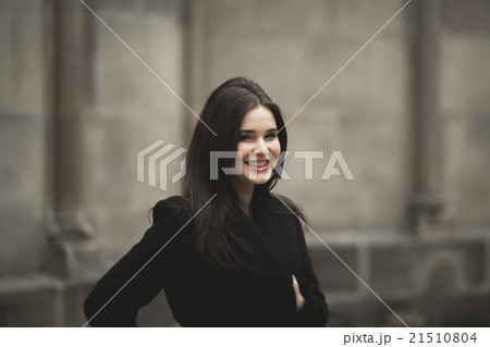 Beautiful brunette young woman posing on the Beautiful brunette young woman posing on the 21510804