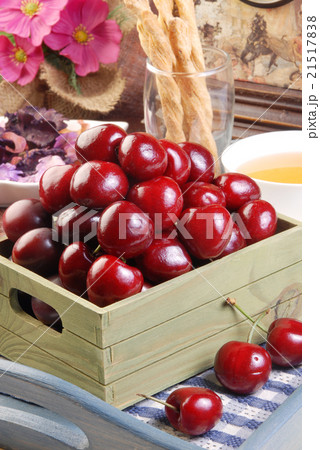 Sweet cherry in a green basket Sweet cherry in a green basket 21517838