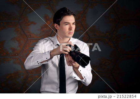Photographer with camera in studio Photographer with camera in studio 21522854
