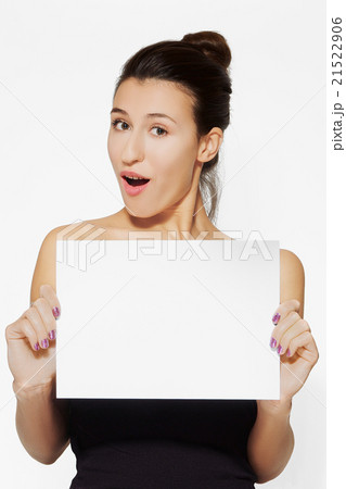 young lady holding blank sheet of paper 21522906