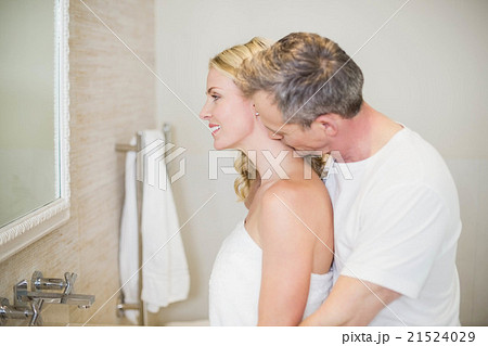 Husband kissing wife on the neck 21524029