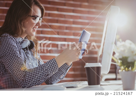 Smiling hipster businessman using tablet Smiling hipster businessman using tablet 21524167