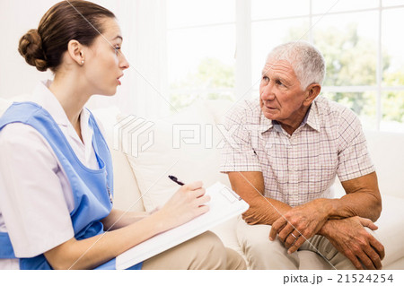 Nurse taking care of sick elderly patient Nurse taking care of sick elderly patient 21524254