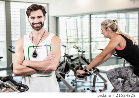 Smiling trainer looking at the camera 21524828