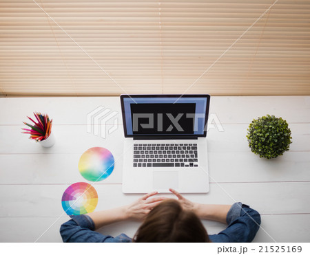 Overhead view of businesswoman using laptop Overhead view of businesswoman using laptop 21525169